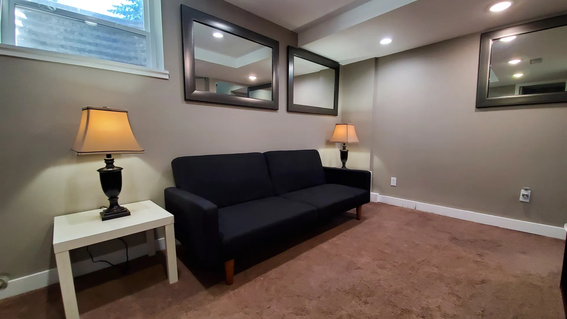 2nd seating area on lower floor with couch