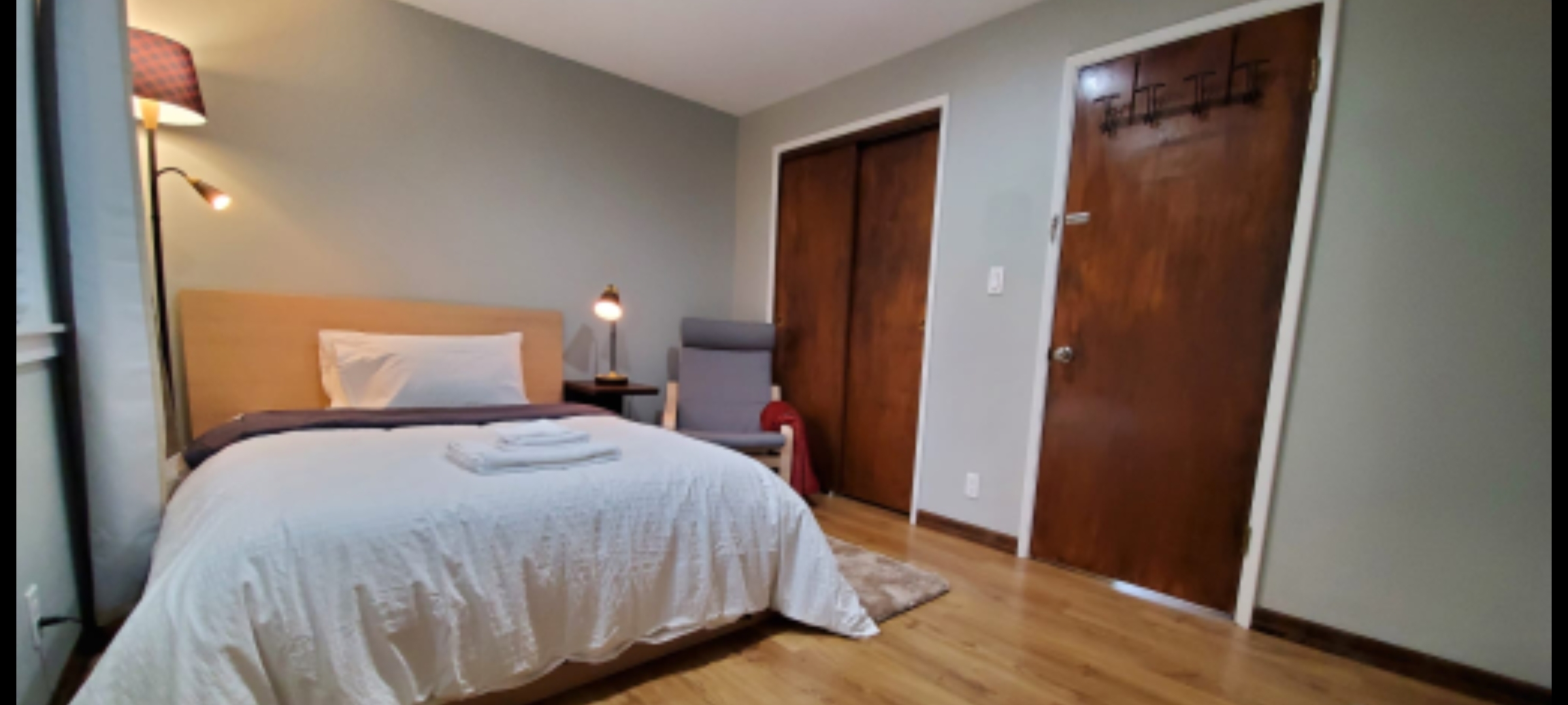 Big closet next to lounge chair
