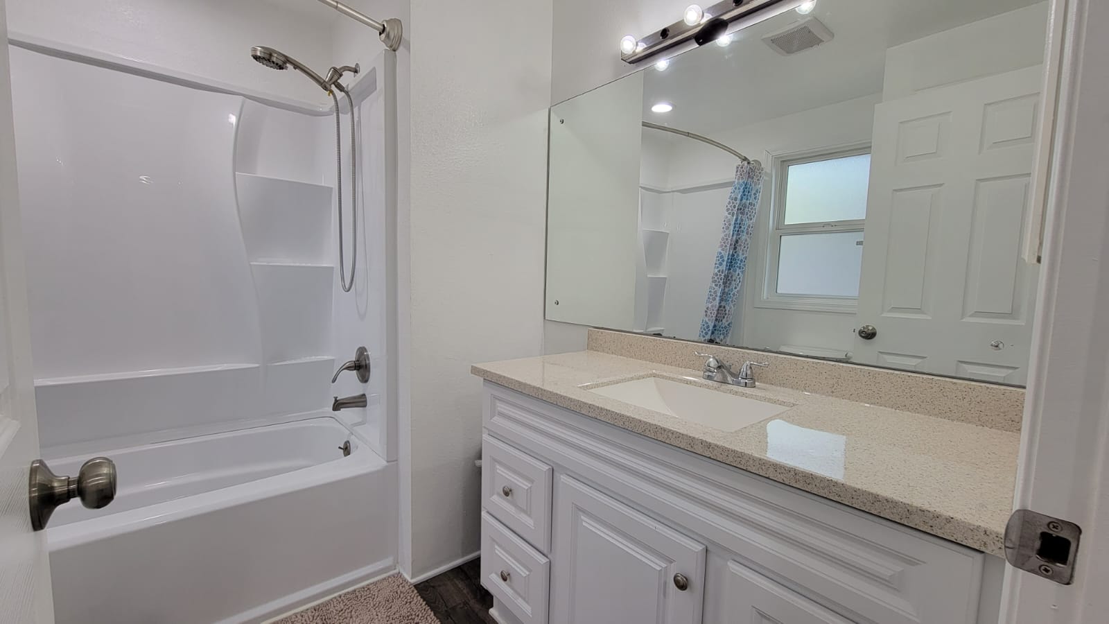 Large bathroom mirror and sink area